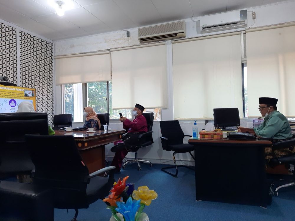 Hadiri Webinar Nasional, Kadiskominfotik Riau Paparkan Kondisi Pandemi COVID-19 di Riau